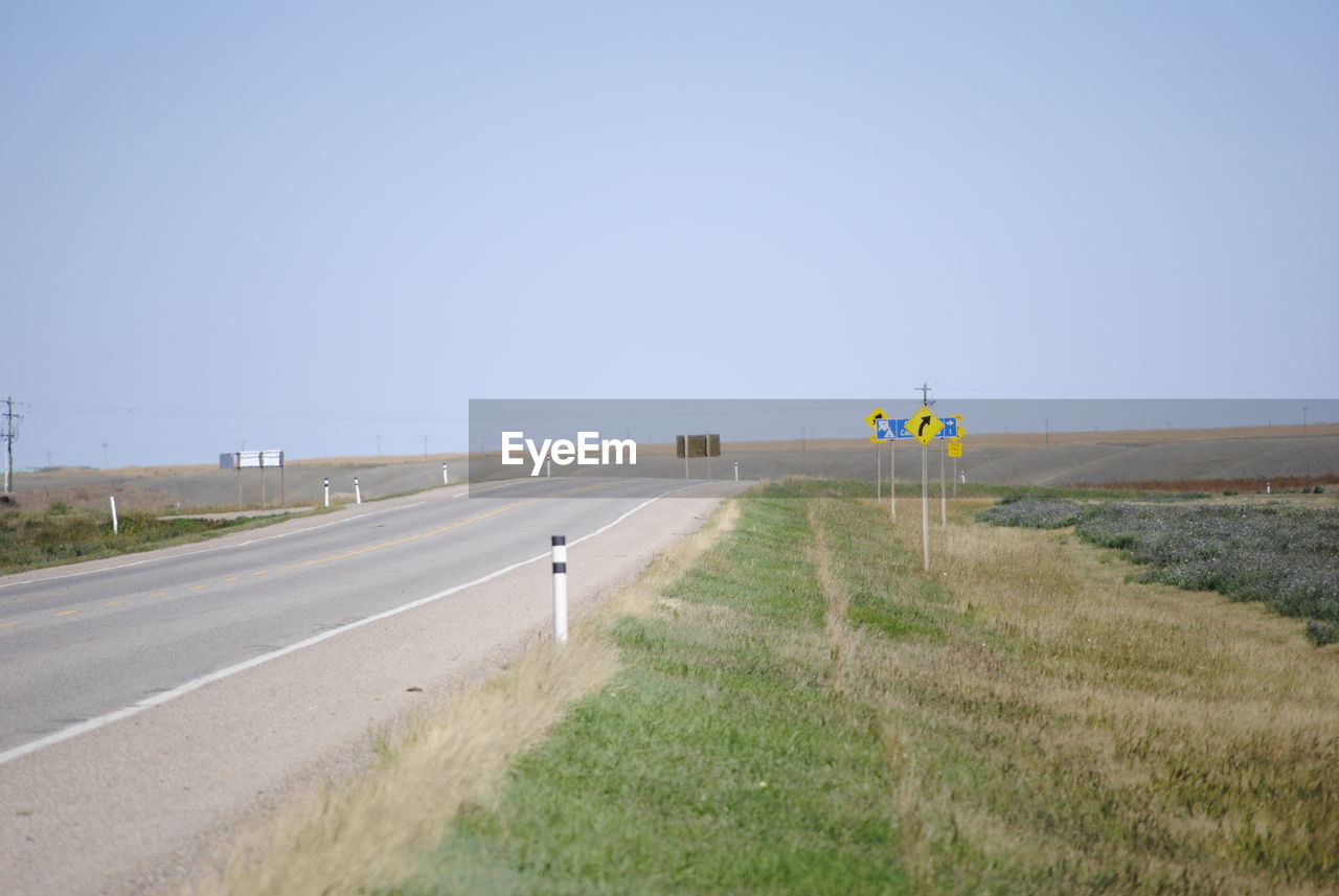 ROAD SIGN ON FIELD