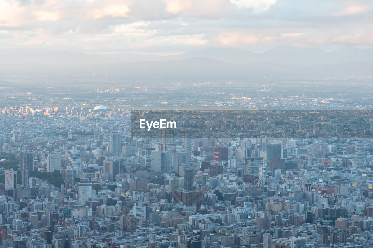 Aerial view of residential district against sky