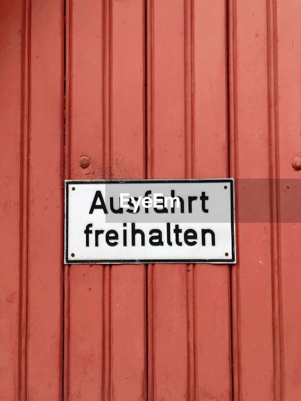 red, communication, text, western script, sign, no people, wood, line, wall, day, close-up, metal, architecture, wall - building feature, number, entrance, full frame, warning sign, door, built structure, maroon, font, outdoors