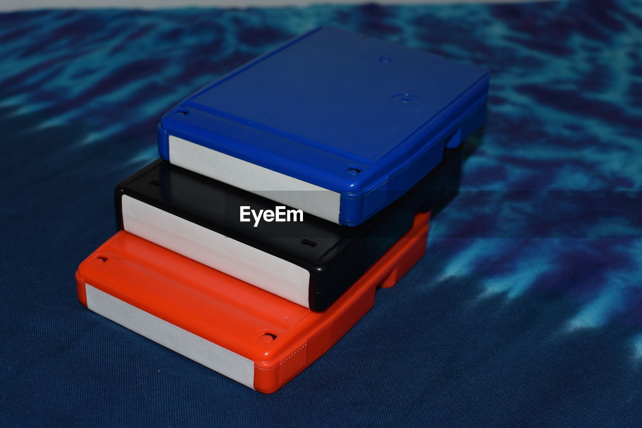 Close-up of stacked colorful 8-tracks