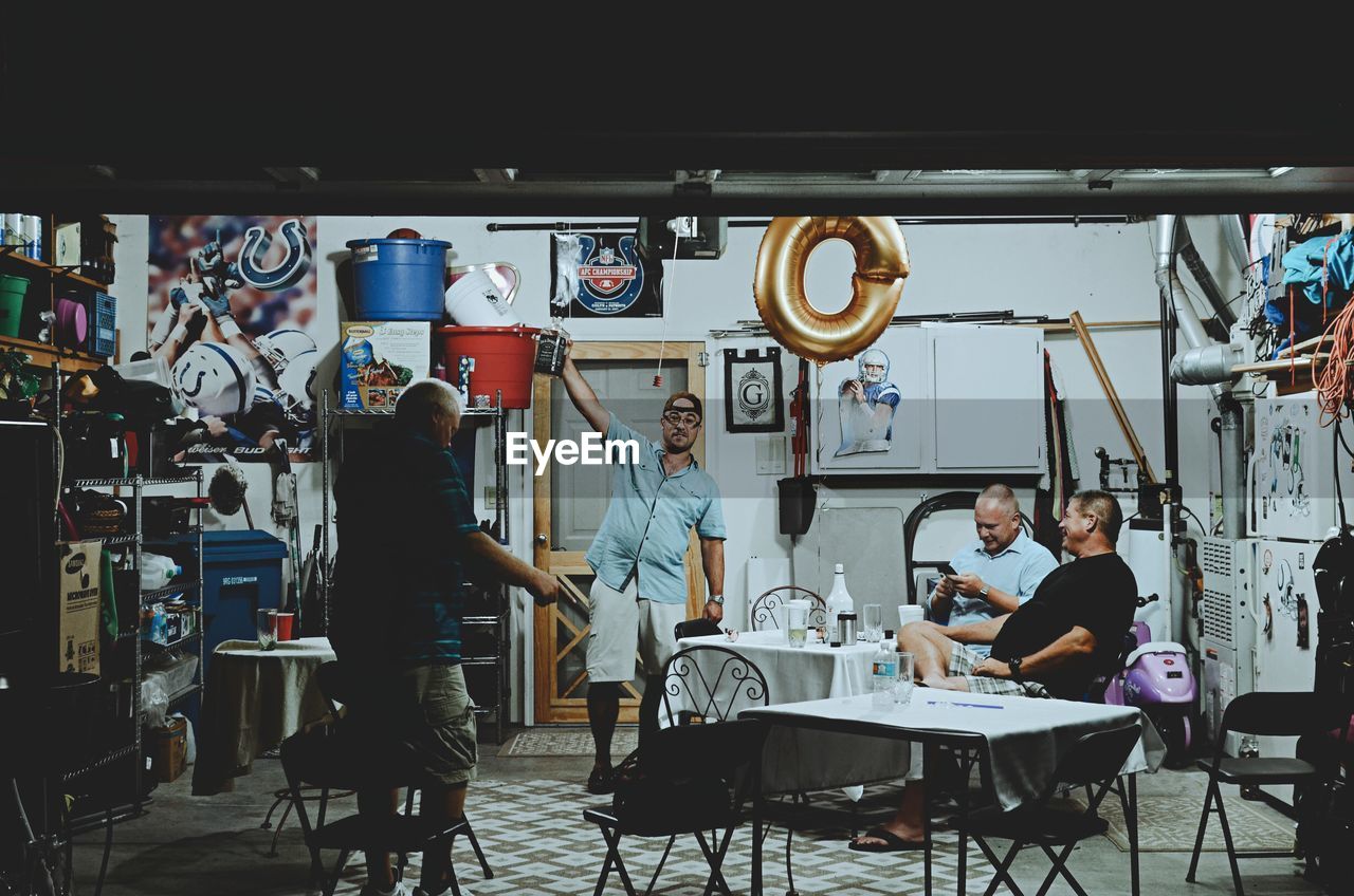 PEOPLE SITTING IN RESTAURANT