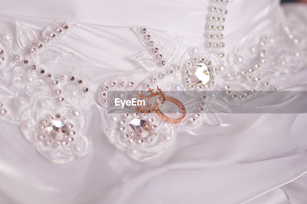 Jewelry on wedding dress