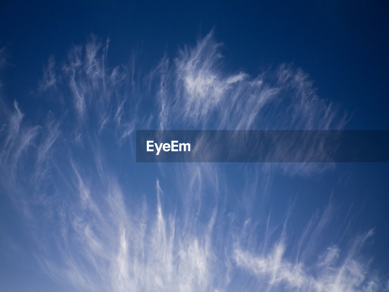LOW ANGLE VIEW OF VAPOR TRAIL IN SKY