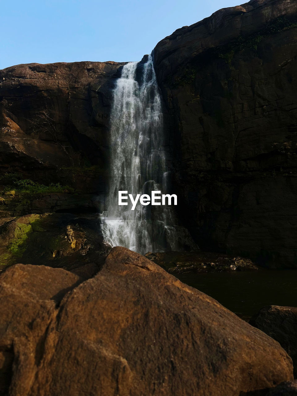 low angle view of waterfall