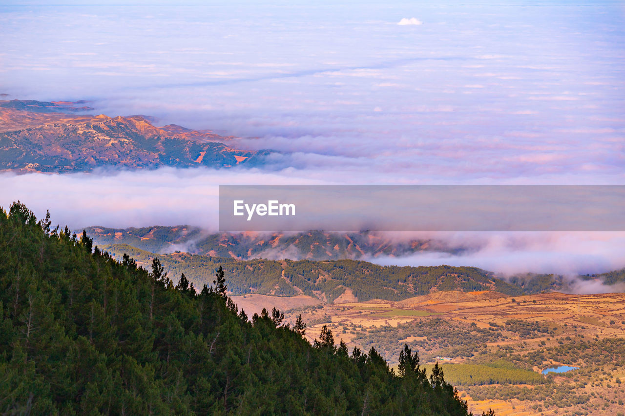 High angle view of cloud filling large valley against sky