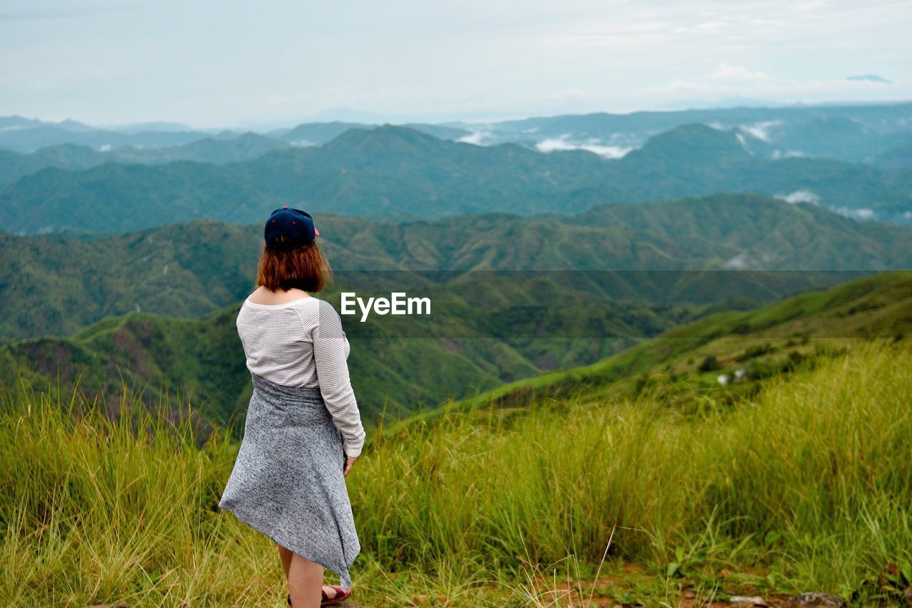 Rear view of woman looking at mountains