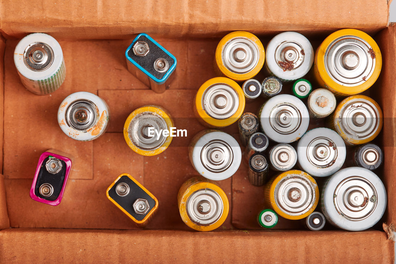 Directly above shot of batteries in cardboard box