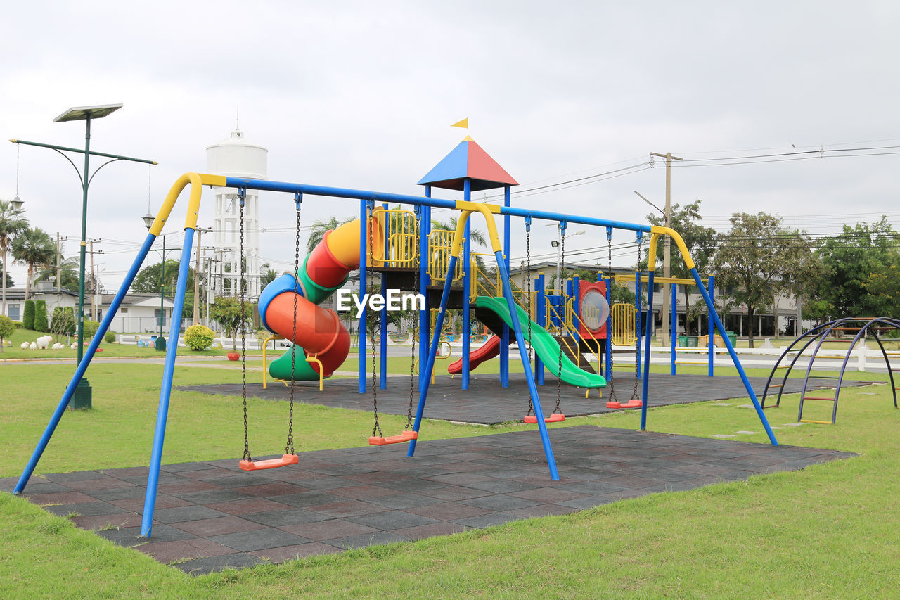 VIEW OF SWING AT PLAYGROUND