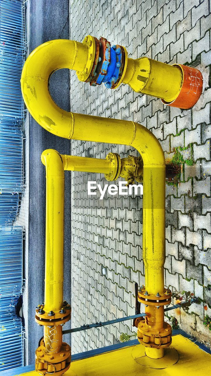 CLOSE-UP OF YELLOW TEXT ON WALL