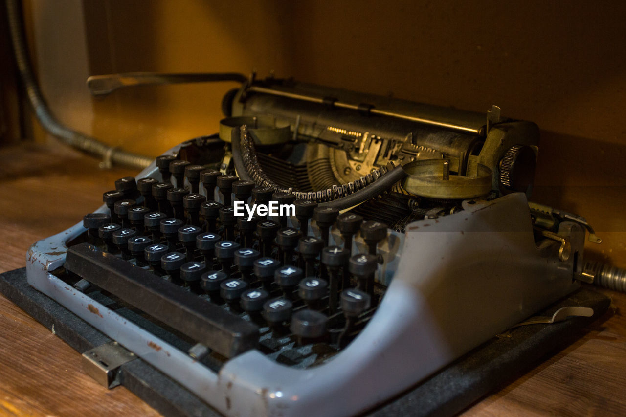 Close-up of old typewriter on table