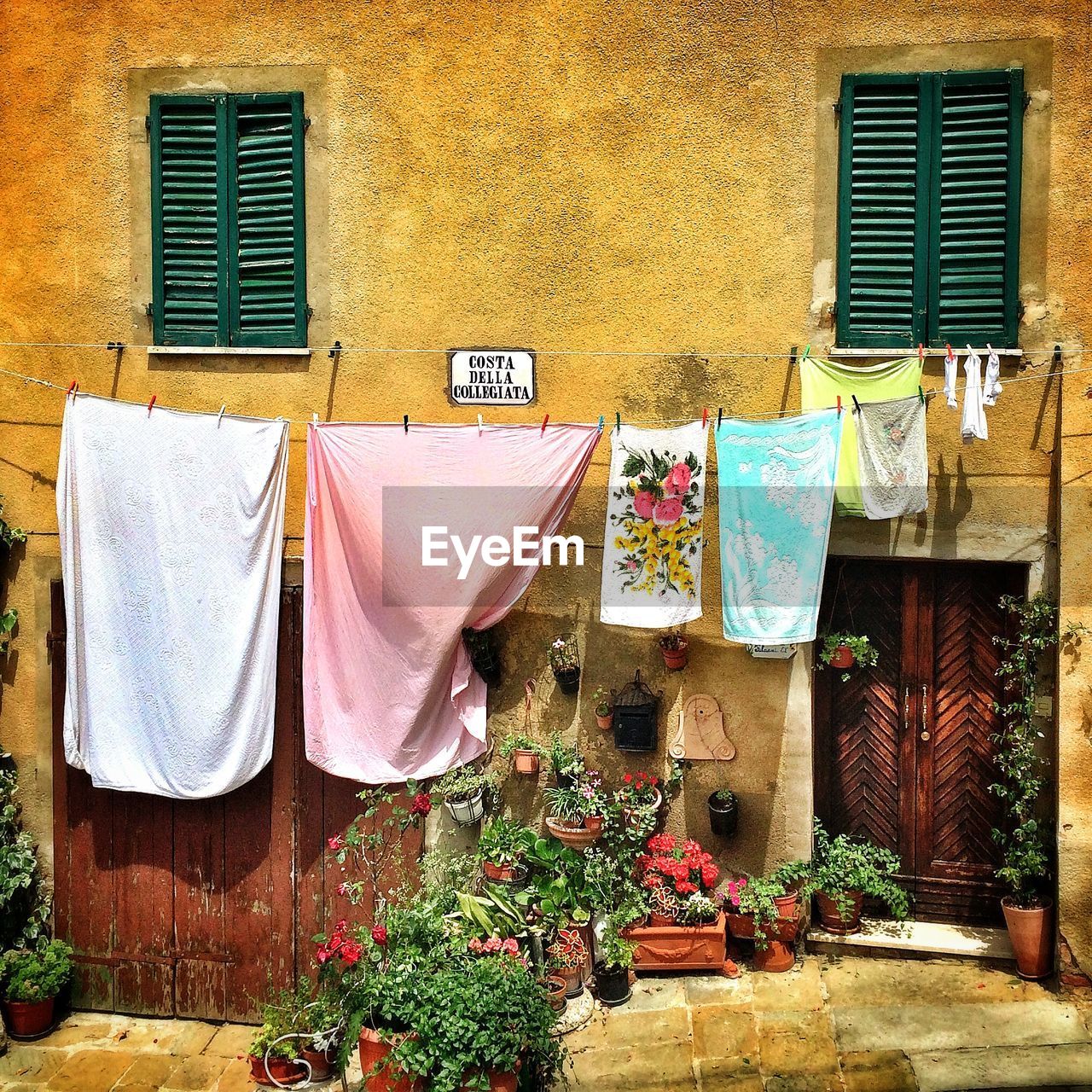 Laundry drying outside house