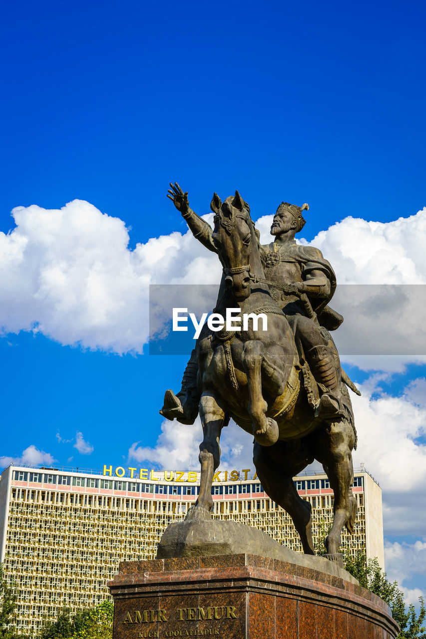 low angle view of statue against clear blue sky