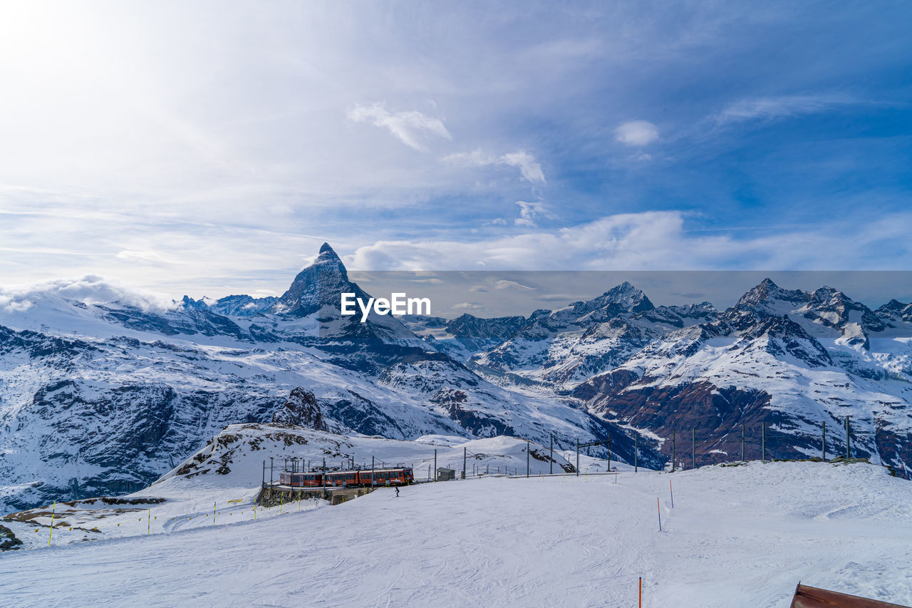 snow covered mountain against sky