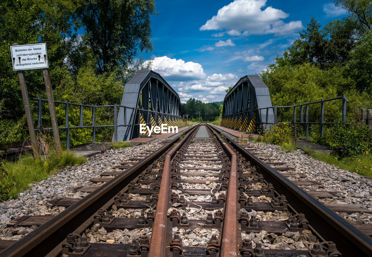 VIEW OF RAILROAD TRACKS ALONG PLANTS