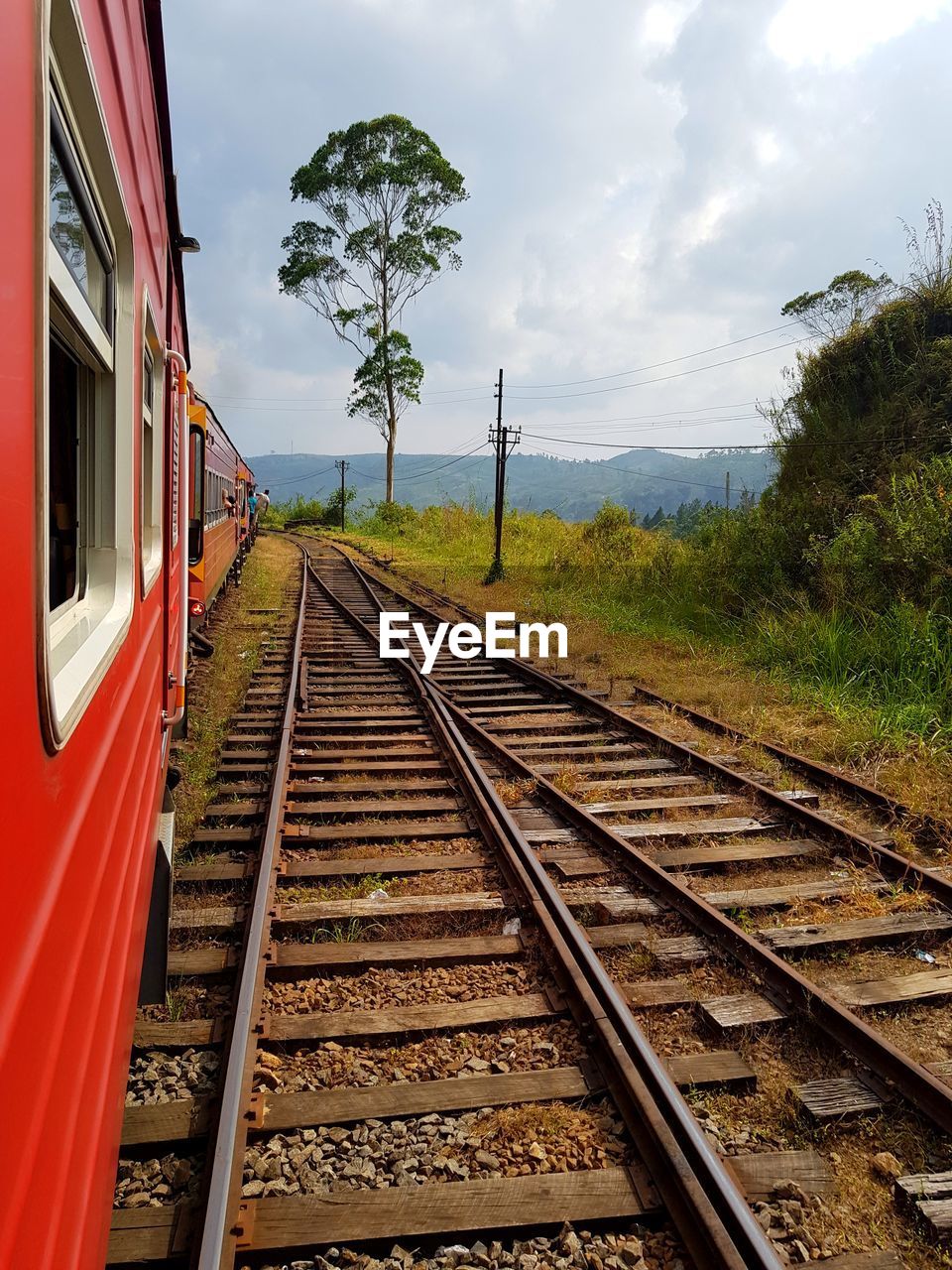 Train on railroad tracks against sky