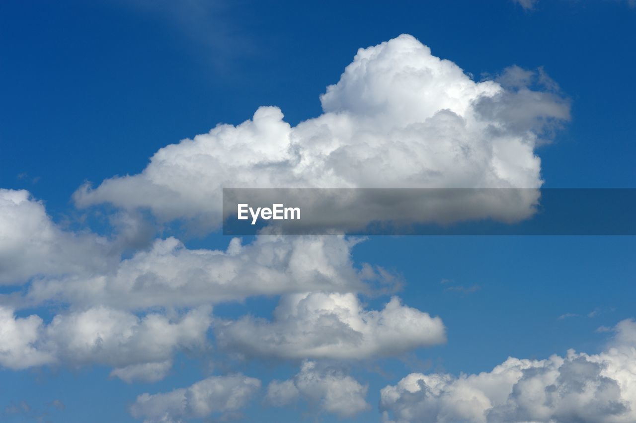 Cumulus clouds in blue sky