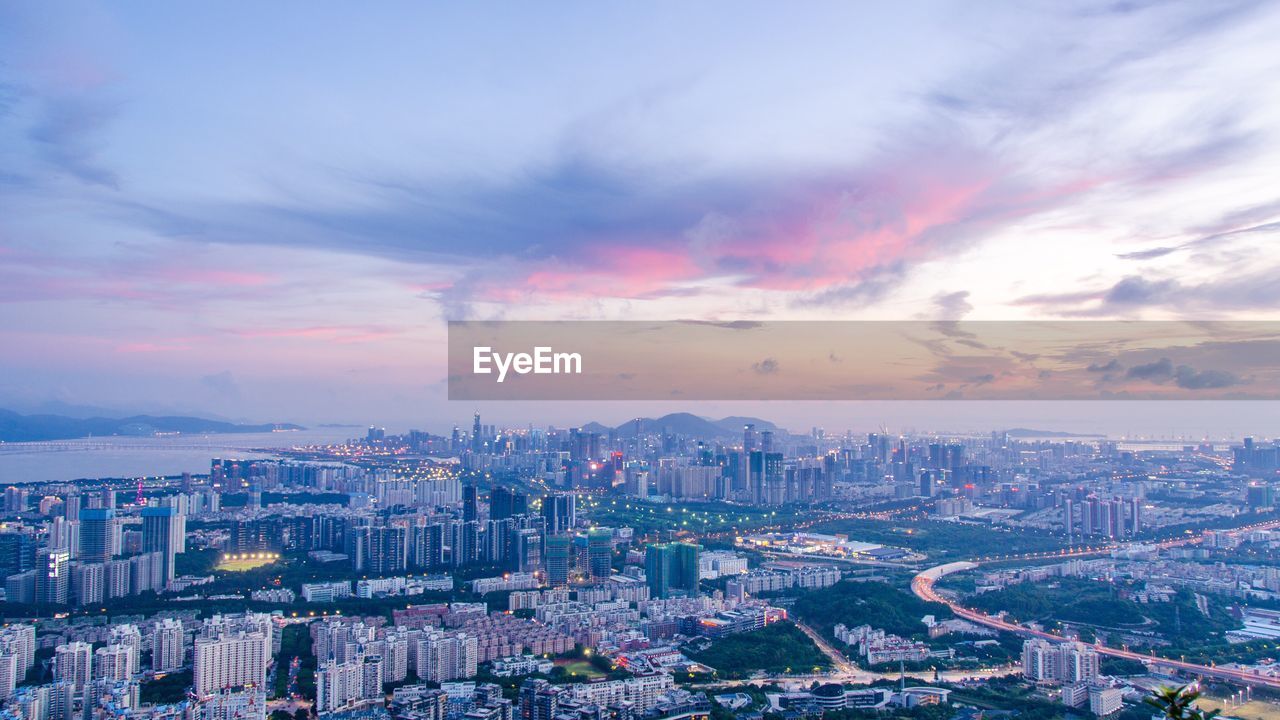 High angle view of city at sunset