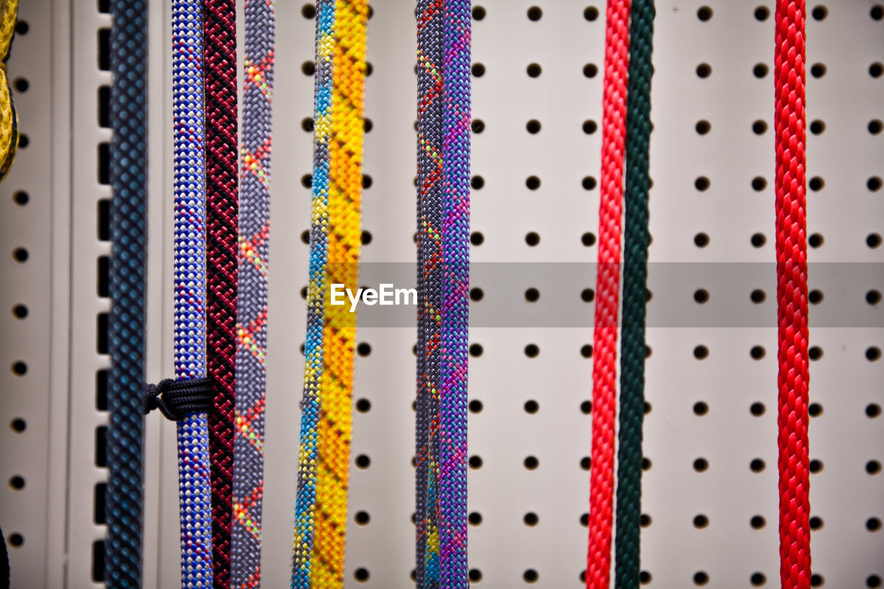 Close-up of colorful ropes hanging in store