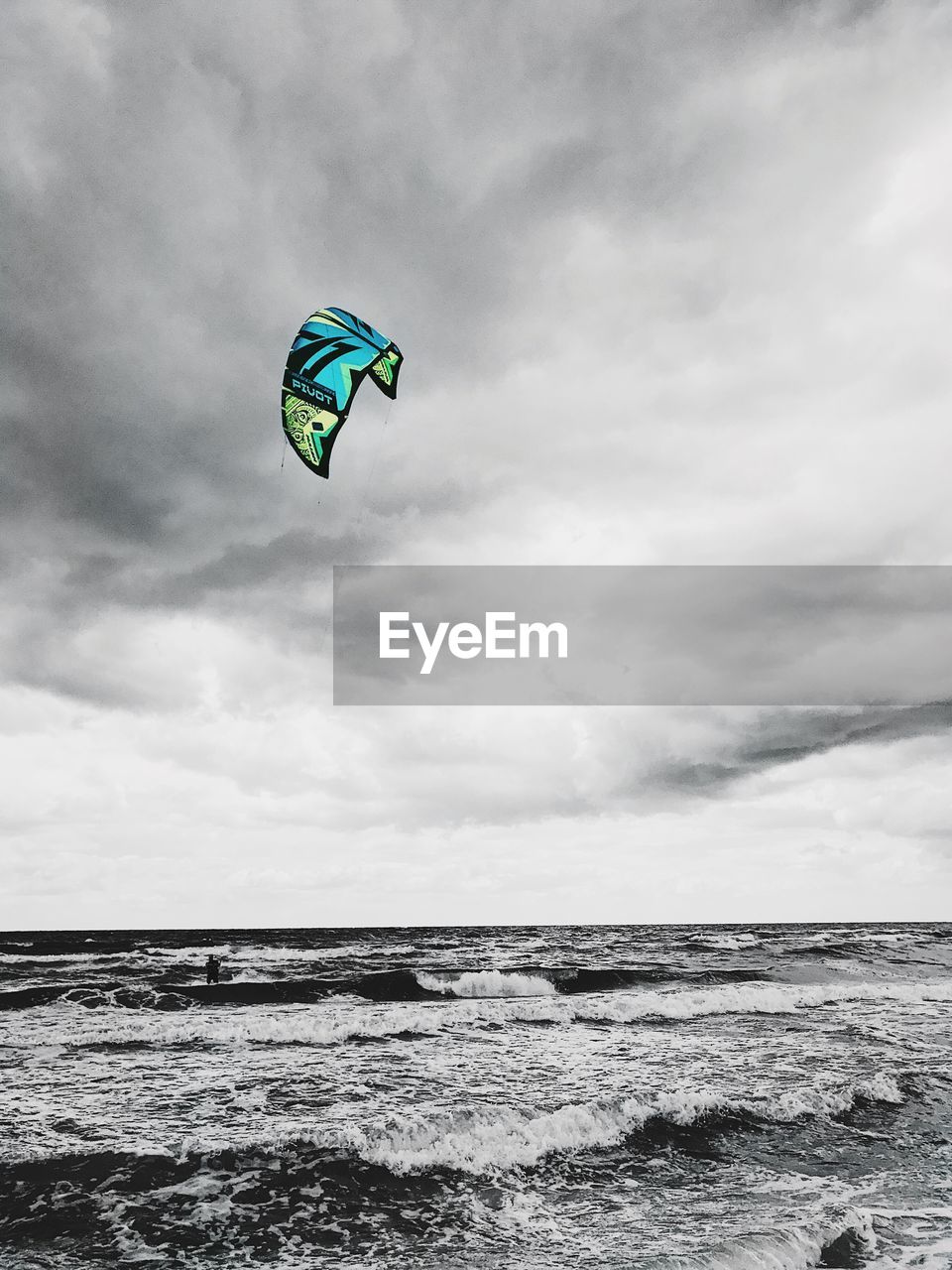 LOW ANGLE VIEW OF UMBRELLA ON BEACH