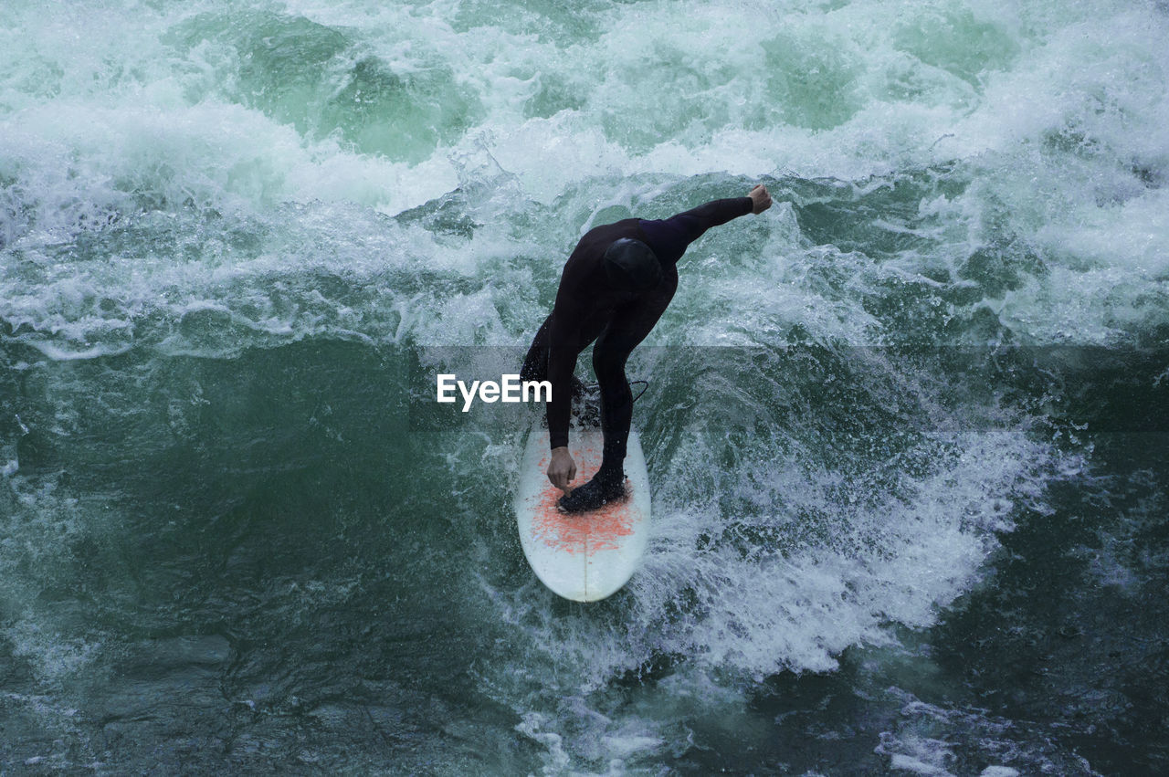 High angle view of man surfing in sea