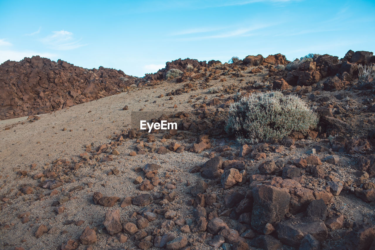 Rock formations on land against sky