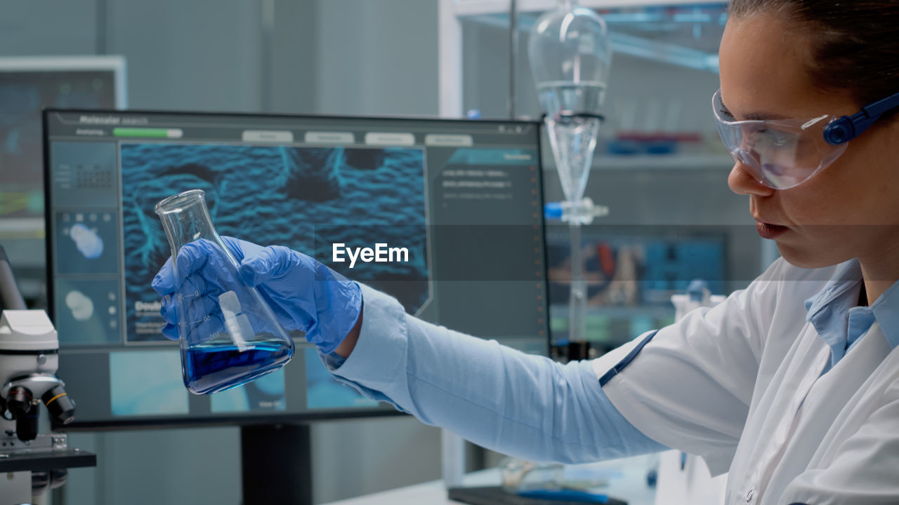 side view of scientist working in laboratory