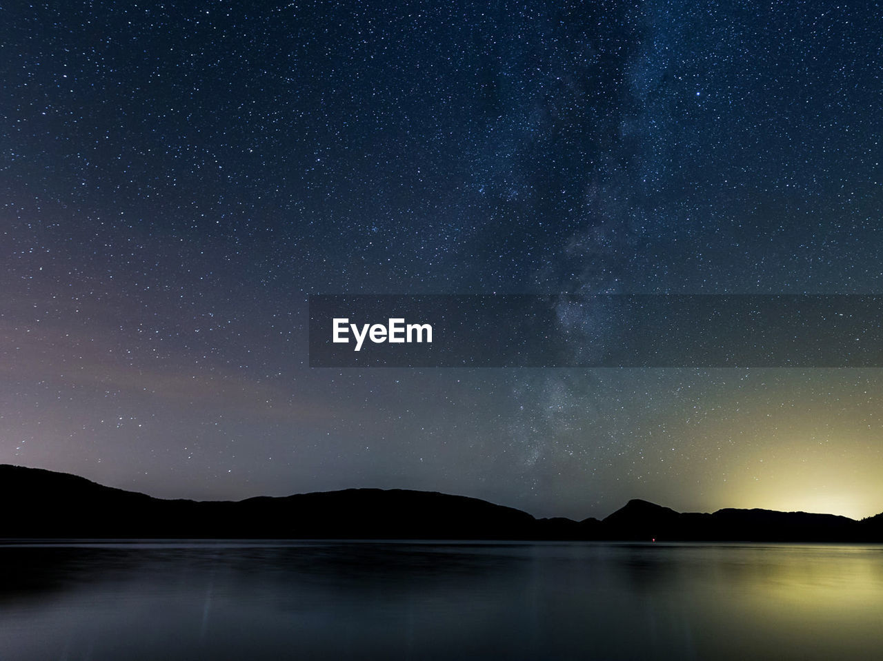 Scenic view of sea against sky at night