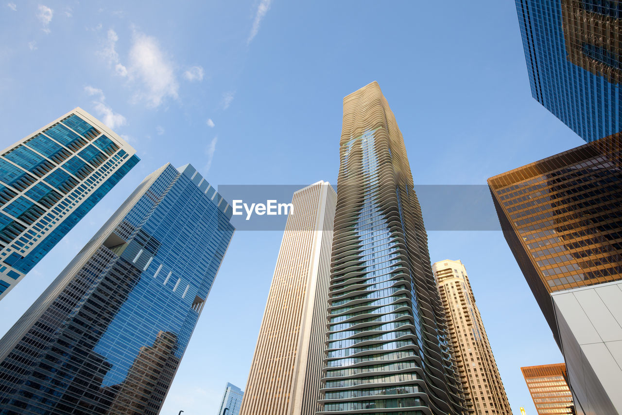 Low angle view of modern buildings against sky in city