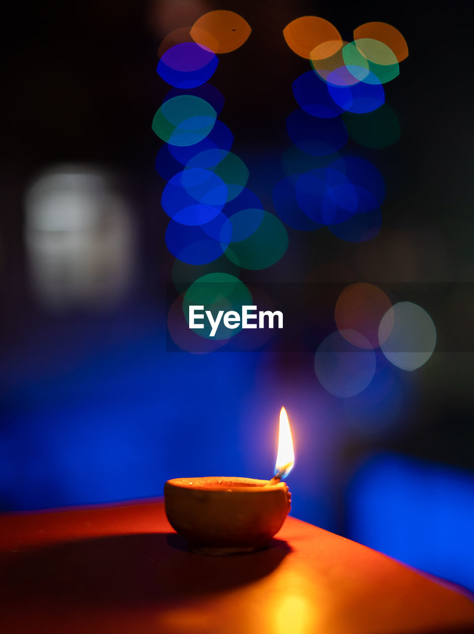 CLOSE-UP OF LIT CANDLES BURNING