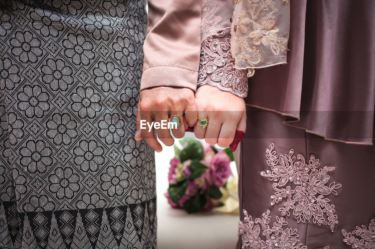 Couple hugging on their wedding. bride and groom holding hands.