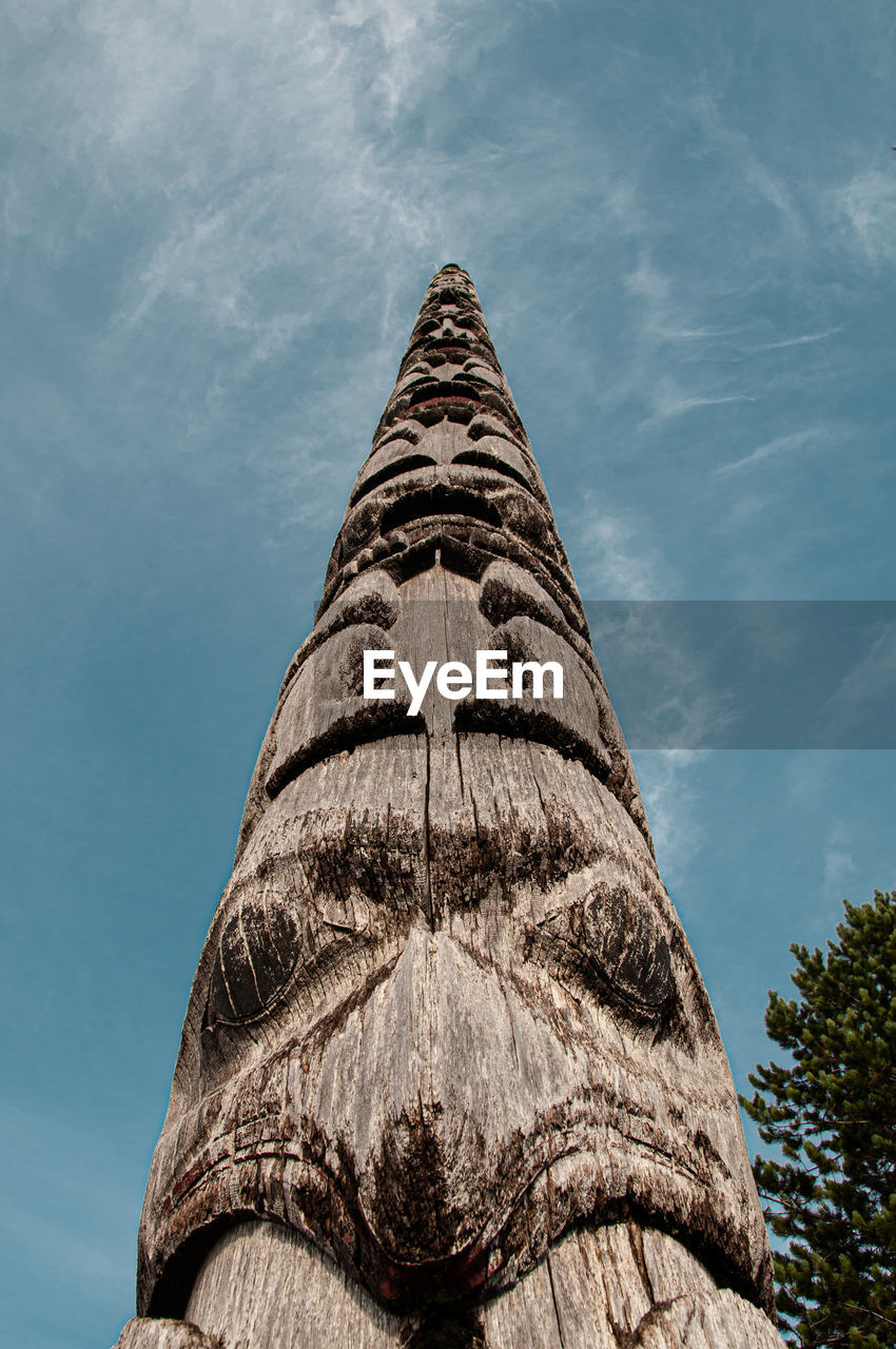 Low angle view of totem against sky