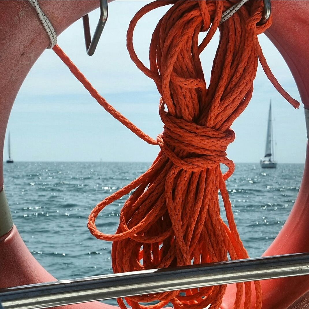 Rope and life belt against sea