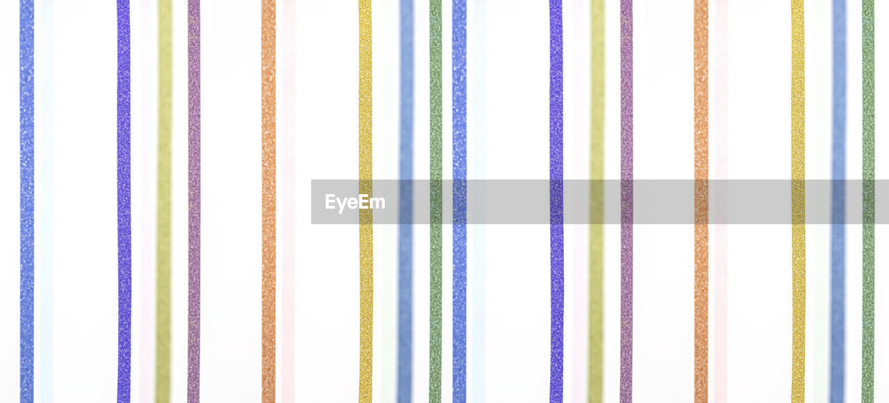 pattern, backgrounds, full frame, multi colored, no people, striped, line, close-up, yellow, textile, font, indoors, in a row, purple, textured, blue, white