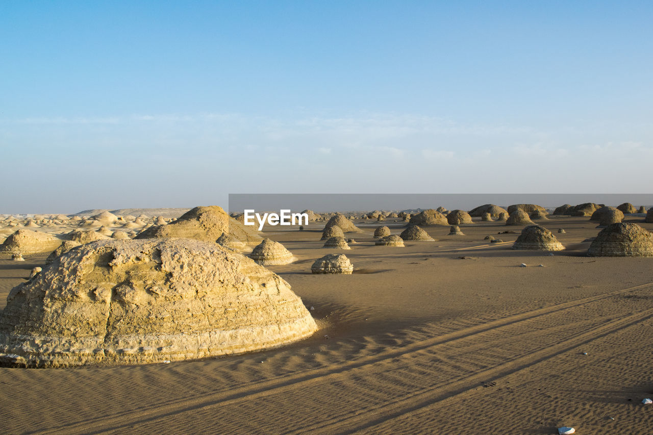 Panoramic view of desert against sky