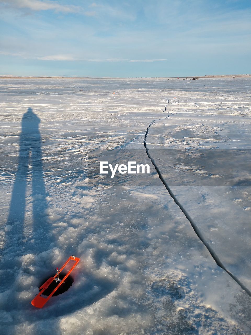 HIGH ANGLE VIEW OF SNOW COVERED LAND