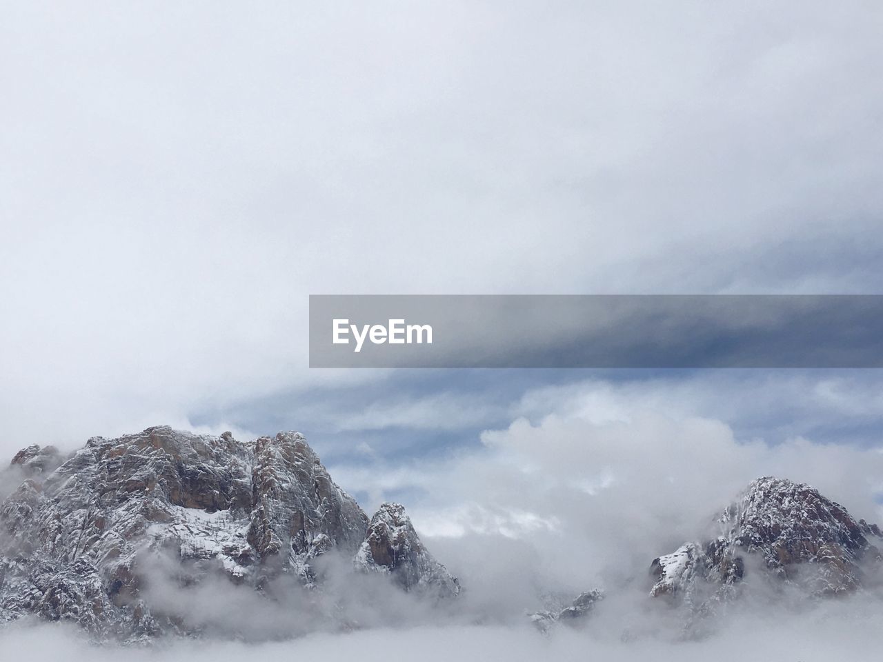 Snow covered mountains against sky