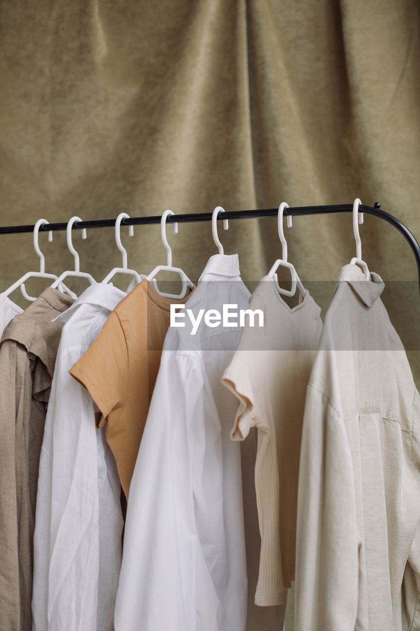 Close-up of clothes hanging on rack