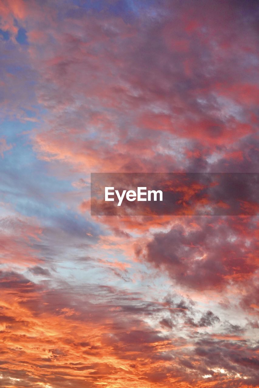 Low angle view of dramatic sky during sunset