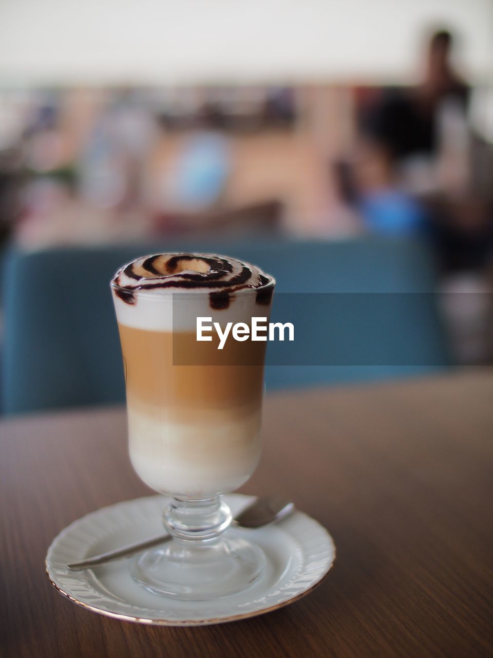 Close-up of coffee served on table at cafe