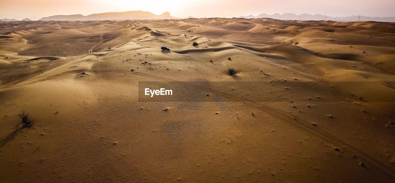 Scenic view of desert against sky