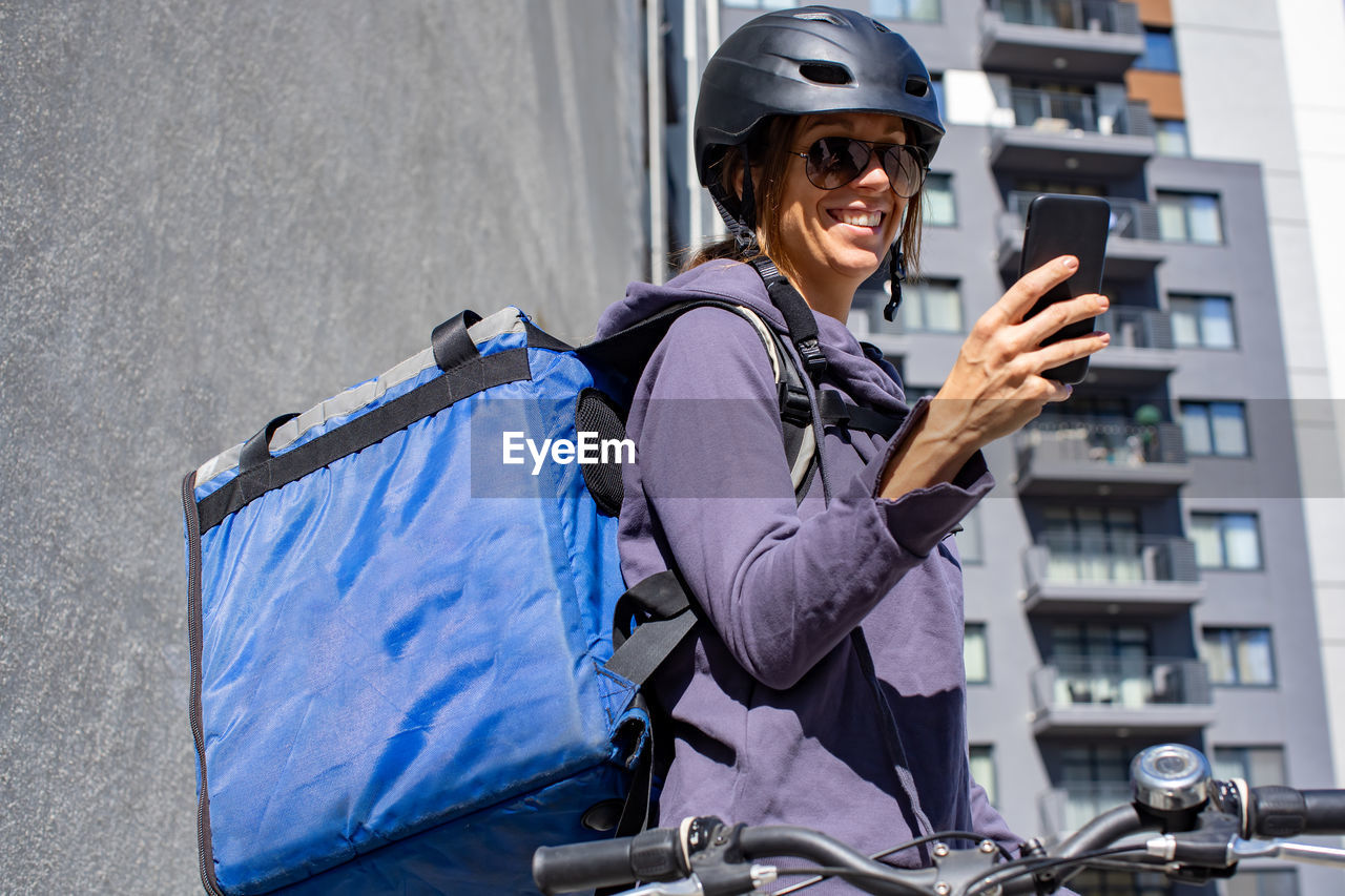 Female delivery person receiving order