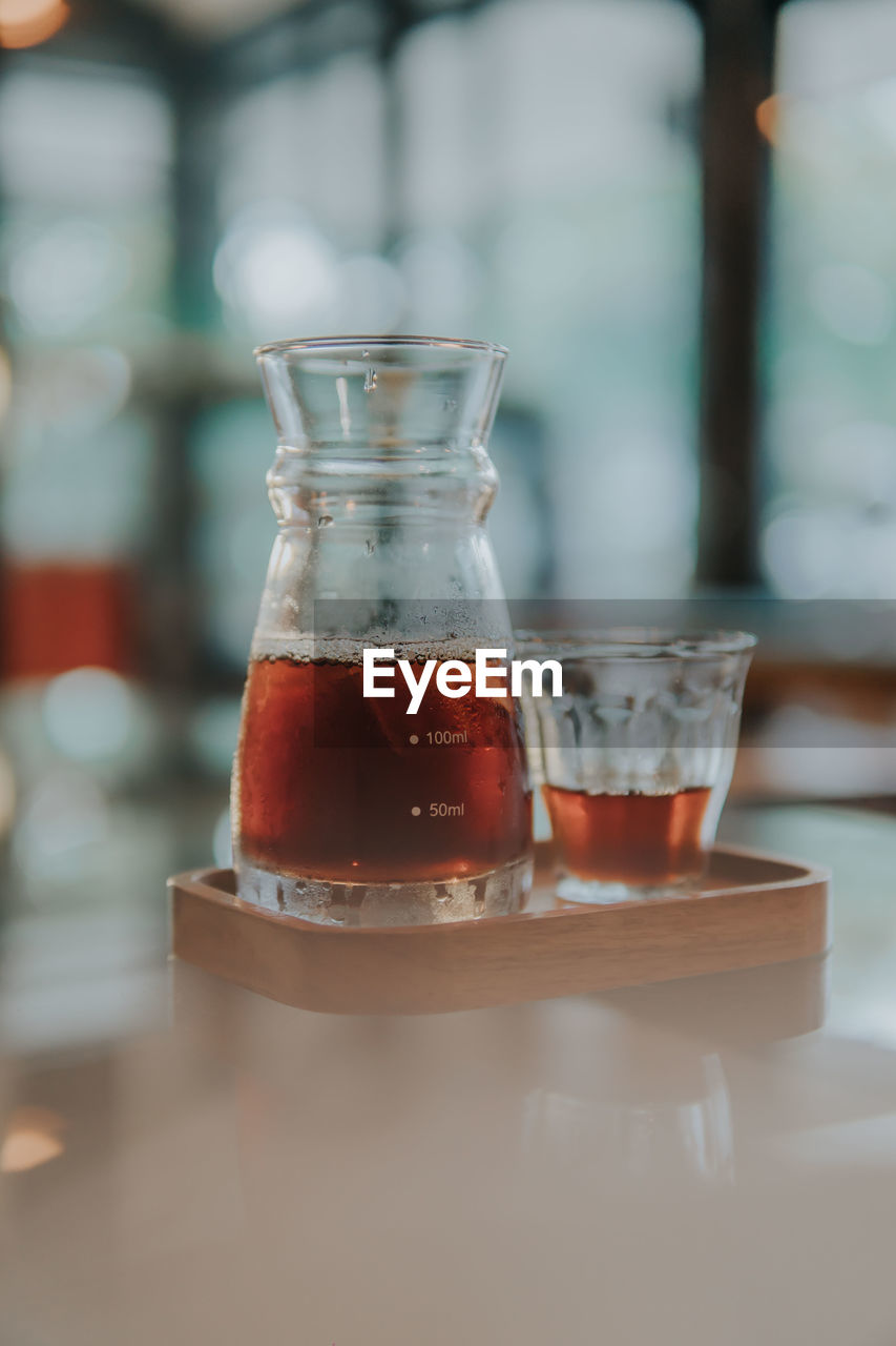 Close-up of coffee in glass on table