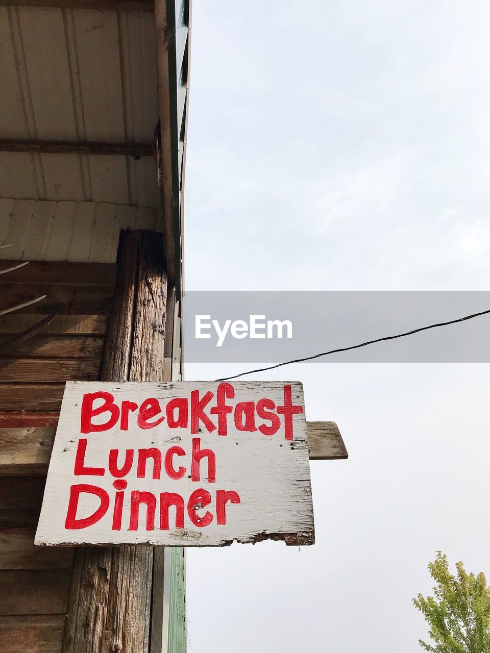 LOW ANGLE VIEW OF SIGN AGAINST SKY