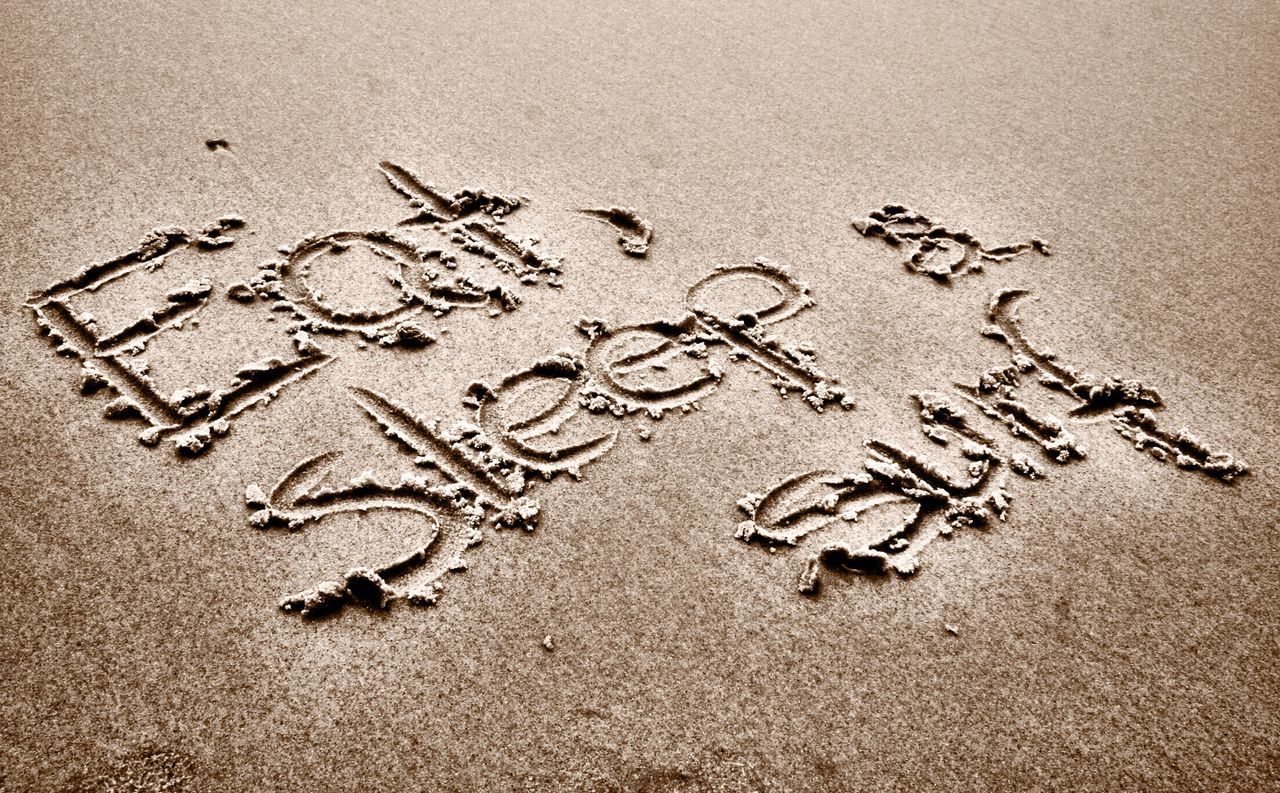 High angle view of message written on beach