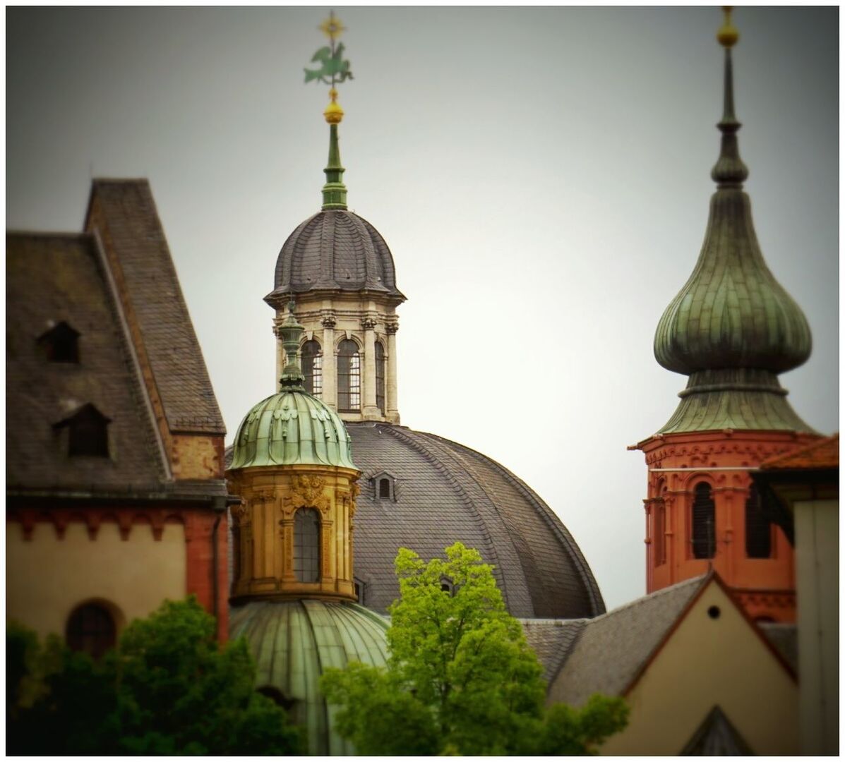 LOW ANGLE VIEW OF CHURCH WITH TREES IN BACKGROUND