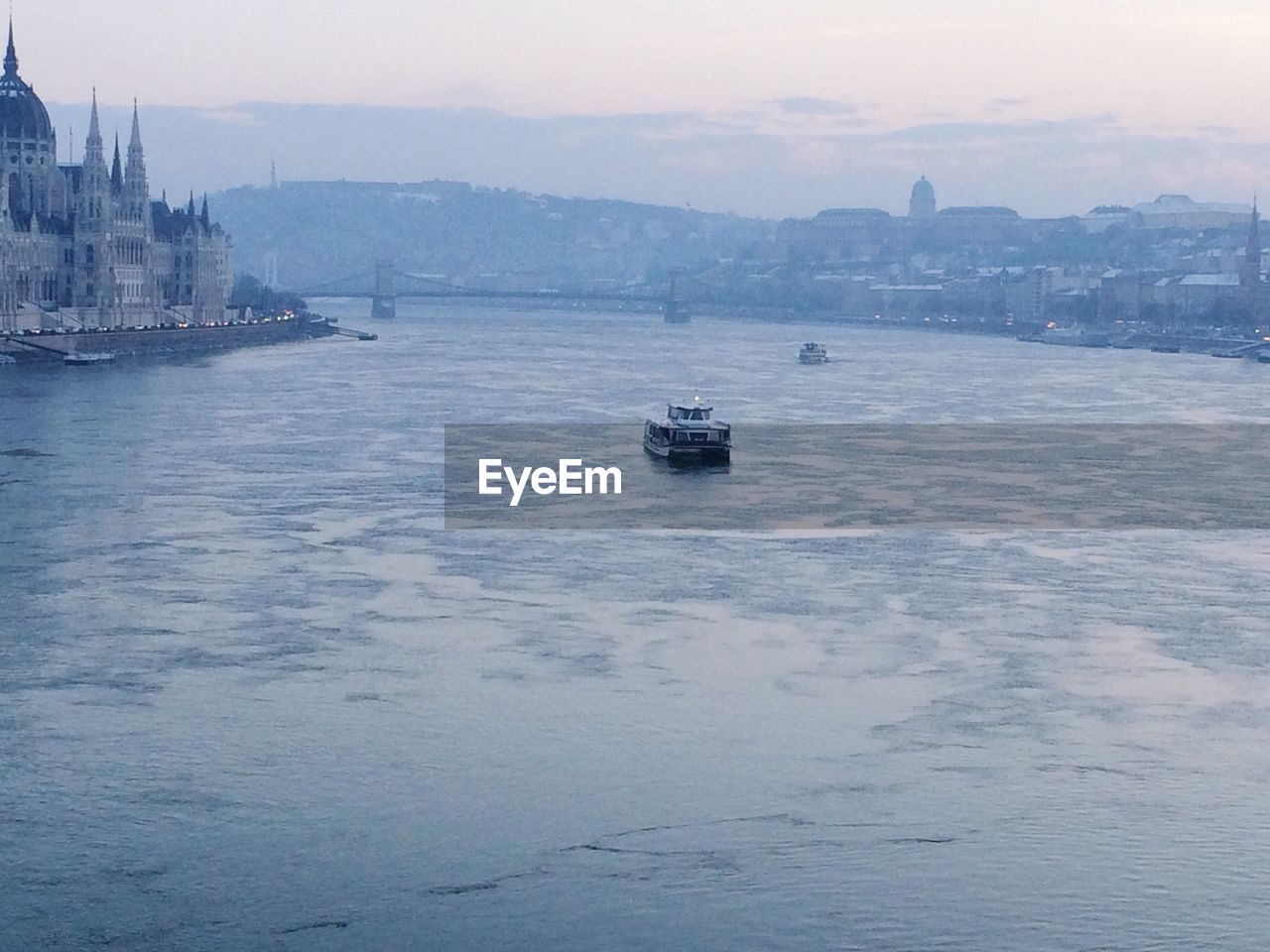 VIEW OF BOATS IN RIVER