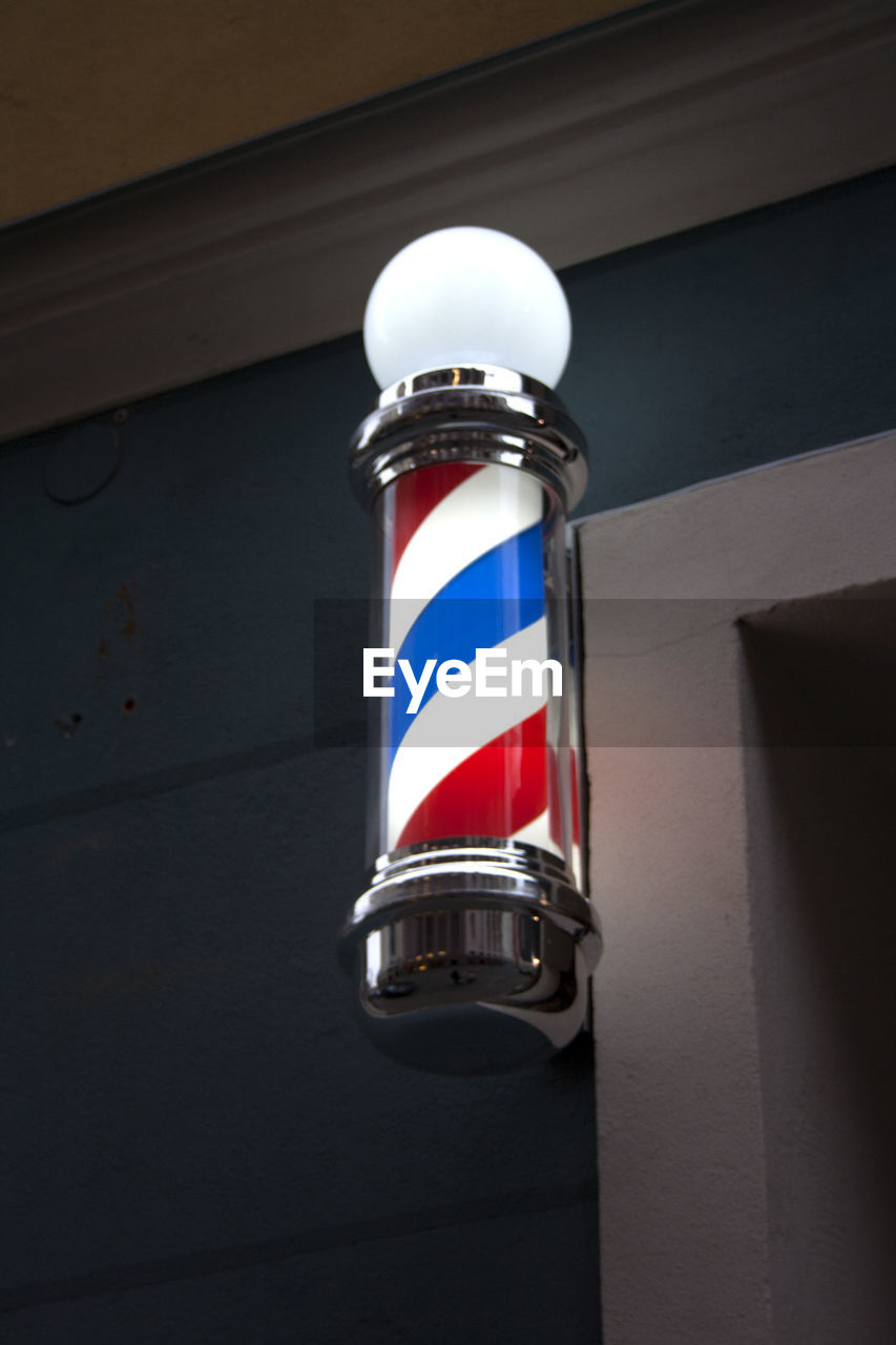 LOW ANGLE VIEW OF RED ELECTRIC LAMP