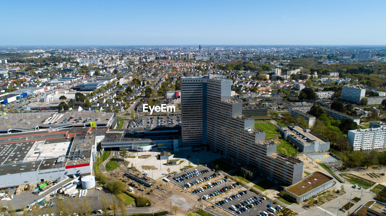 HIGH ANGLE VIEW OF BUILDINGS AGAINST CLEAR SKY