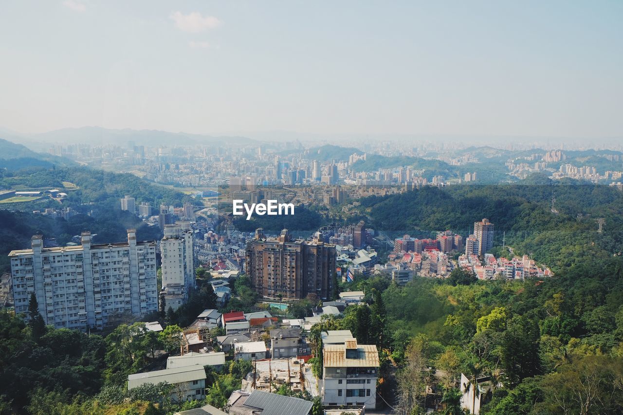 Aerial view of cityscape against sky