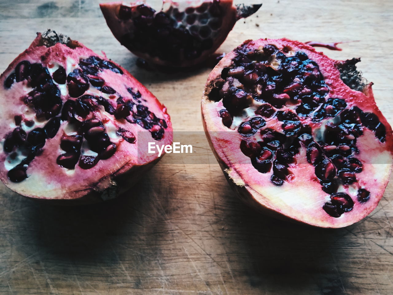 Close-up of pomegranate slices on table